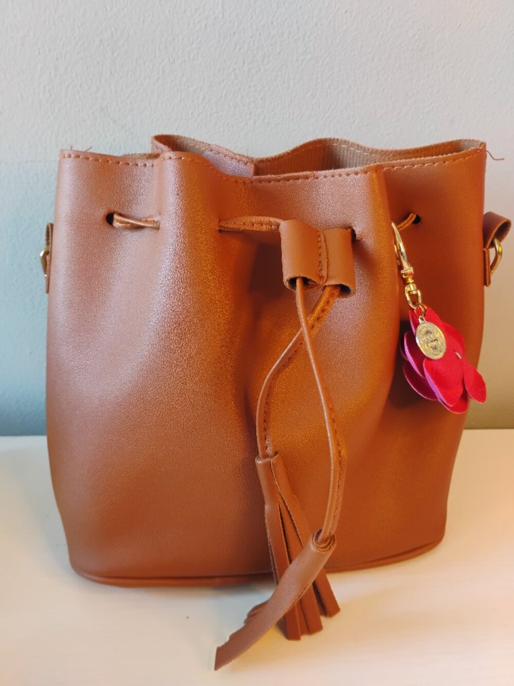 Mini  drawstring bag with charm